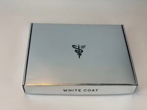 Custom luxury silver metallic corrugated mailer box with black brand logo