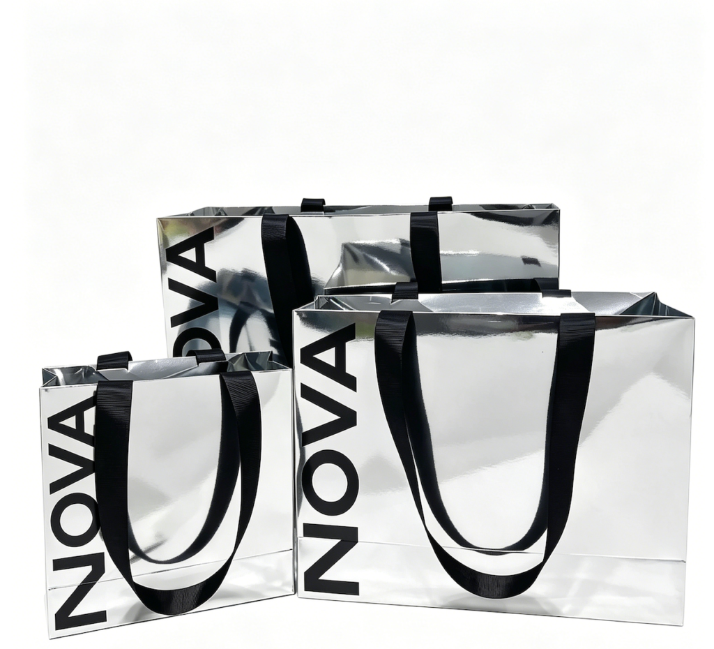 Multi-size-silver-mirror-metallic-paper-shopping-bags-set-high-gloss-reflective-gift-totes-with-black-ribbon-handles-for-brand-packaging.