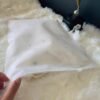 White textured non woven apparel zipper bag single product shot