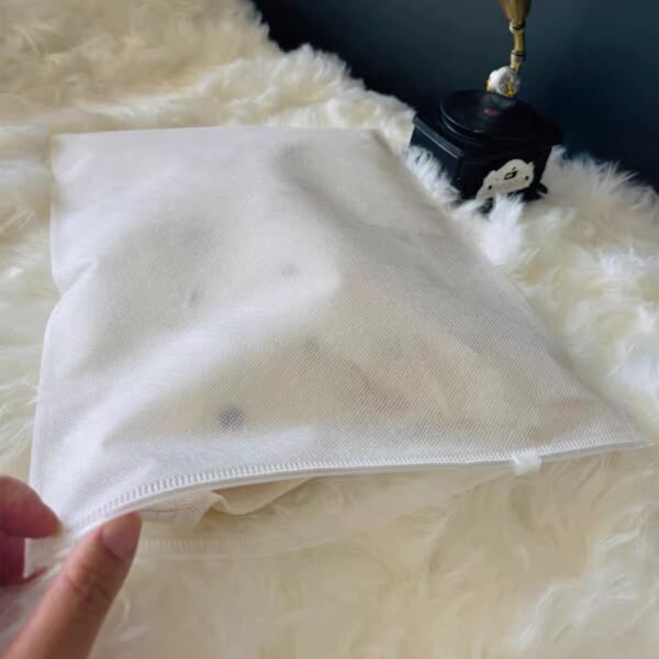 White textured non woven apparel zipper bag single product shot