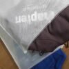 Custom brand logo printed on matte non woven clothing zip pouch close-up