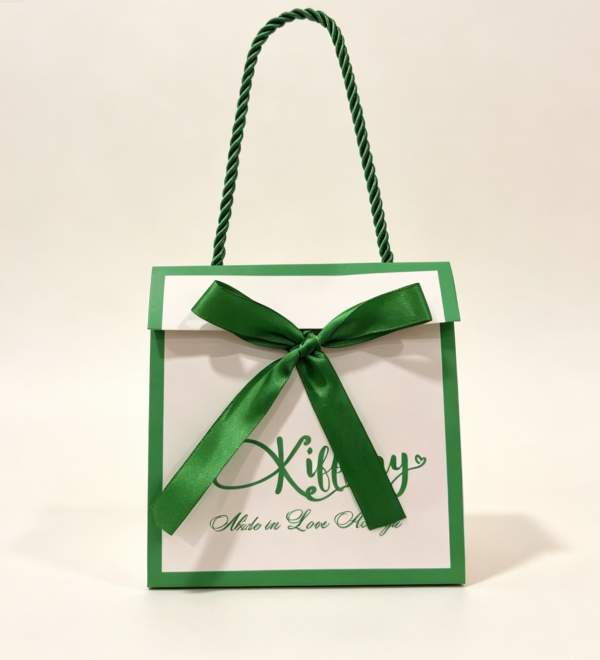 Custom fold over gift paper bag with matching satin ribbon bow and twisted rope handle
