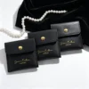 black-pu-leather-jewelry-pouch-metal-snap-button Custom Drawer Jewelry Box with Foil Stamped Logo and PU Leather Pouch Set