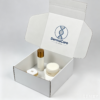Custom printed white tear strip mailer box with inner Dermacare brand logo, pre-packed full skincare set including toner, cream and serum jars, cosmetic gift packaging