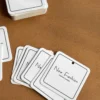Stack of custom paper hang tags for clothing brands