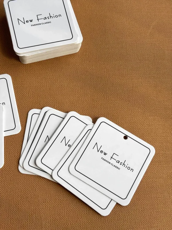 Stack of custom paper hang tags for clothing brands