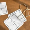 White custom clothing hang tags with printed brand logo