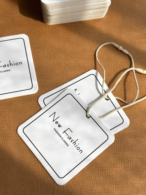 White custom clothing hang tags with printed brand logo
