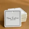 Custom paper clothing hang tags with string attachment