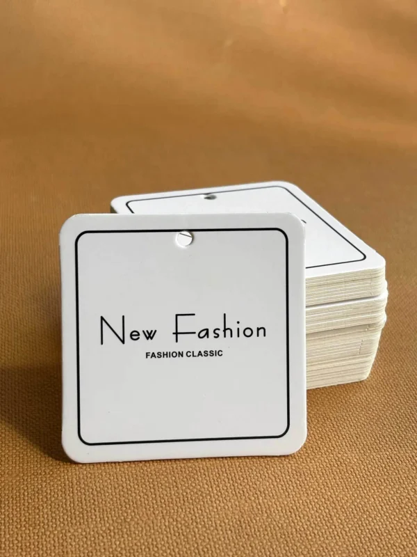 Custom paper clothing hang tags with string attachment